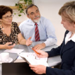Senior couple meeting with agent or financial advisor to create a financial plan