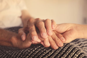 Parent and Child holding hands for living will and estate planning blog - Stableford Capital
