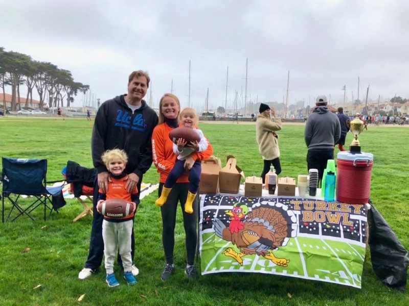 Stableford Turkey Bowl family on field at table with snacks and drinks and the trophy