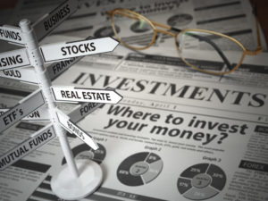 where to invest and how to find a financial advisor that will diversify your investment portfolio newspaper and direction sign for asset allocation stableford