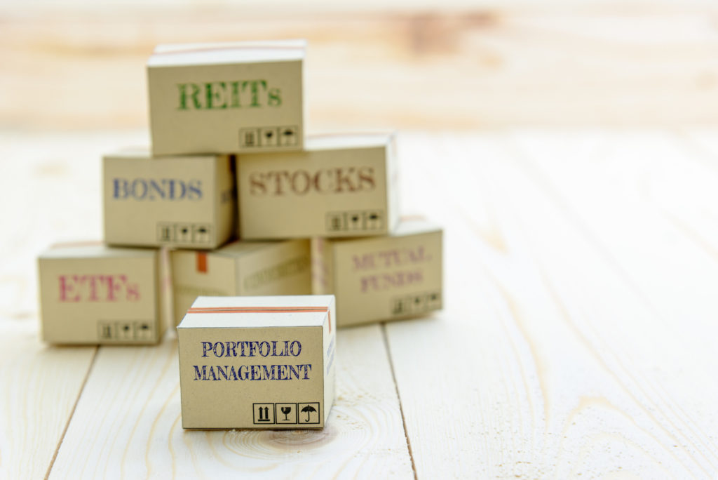 risk diversification for portfolio management and index fund investment strategy blog with boxes on table - Stableford