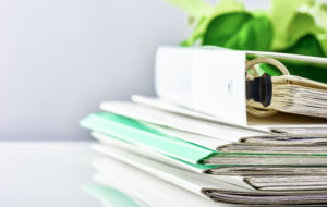 Proper documentation for paycheck protection program is key - stack of files and folders