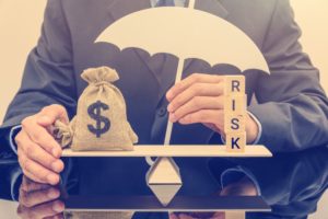 Balancing asset management and portfolio risk on a scale comparing dollars to risk - Stableford_web