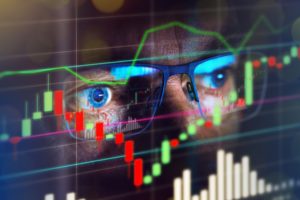 market commentary August 2020 - Nasdaq with close up of stock broker eyes looking at screen-web