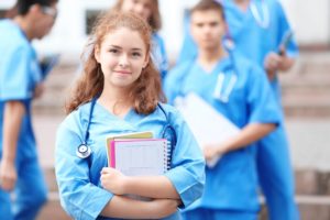 Education and Healthcare Stableford Blog female medical student holding books-web