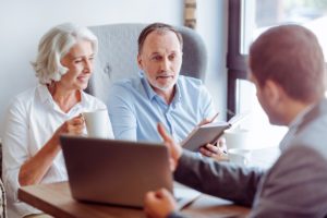 Older couple meeting with financial advisor - Stableford Blog-web