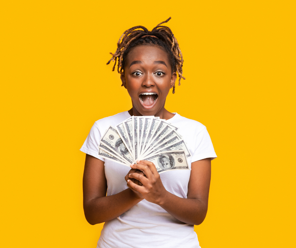 Yellow background with young girl holding a fan of money 